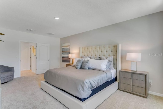 bedroom featuring recessed lighting, baseboards, visible vents, and light colored carpet