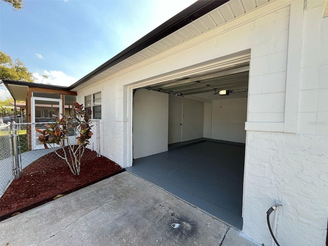 view of exterior entry with concrete driveway