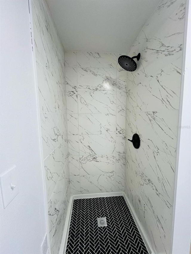 bathroom with a shower stall