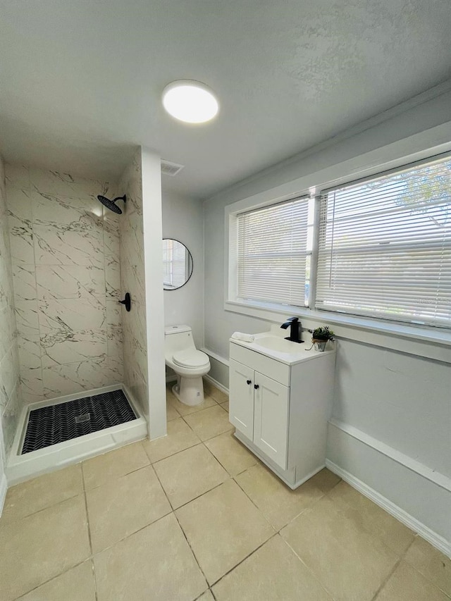 full bathroom featuring toilet, a shower stall, visible vents, and a wealth of natural light