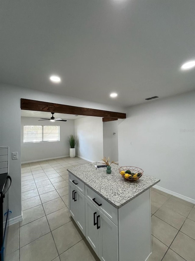 kitchen with recessed lighting, a kitchen island, visible vents, and light tile patterned flooring