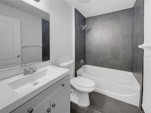 bathroom featuring bathtub / shower combination, vanity, toilet, and tile patterned floors