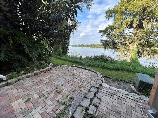 view of patio with a water view