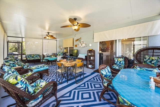 sunroom / solarium featuring ceiling fan