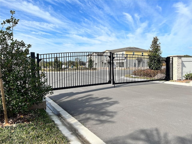 view of gate featuring fence