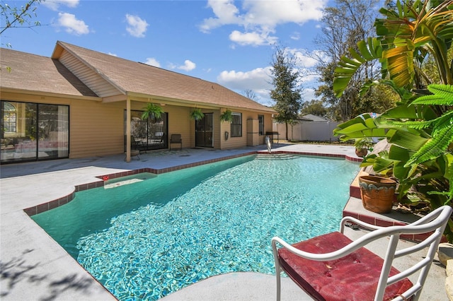 view of swimming pool featuring a patio area, a fenced in pool, and fence