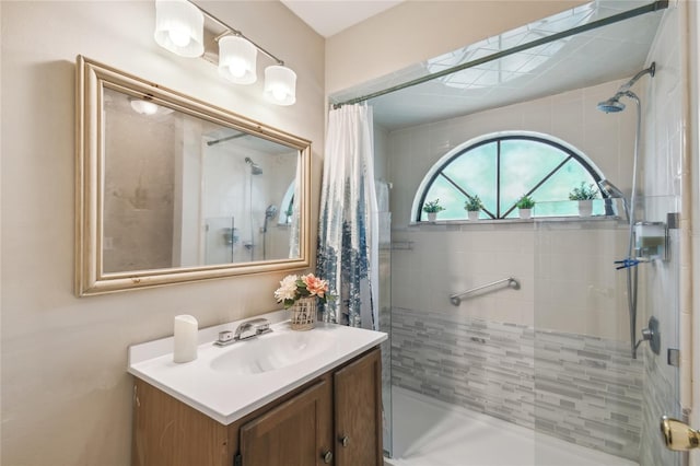 bathroom featuring vanity and a shower stall