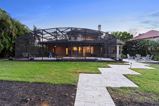 5524 Sail Ct, Orlando, FL 32819 - rear view of property with a patio area, a yard, and glass enclosure