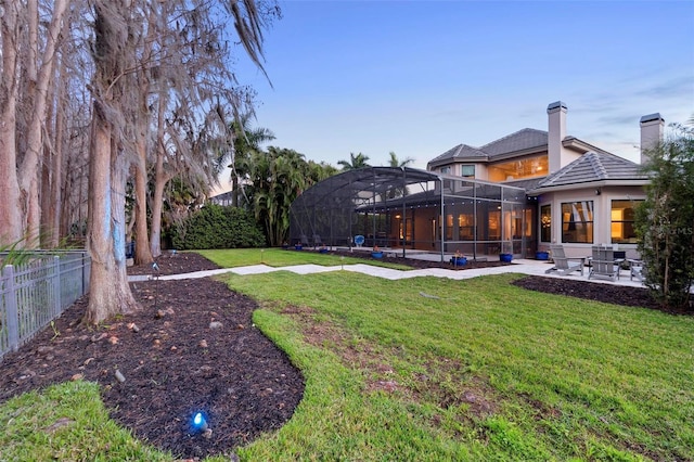5524 Sail Ct, Orlando, FL 32819 - view of yard featuring a patio area and glass enclosure