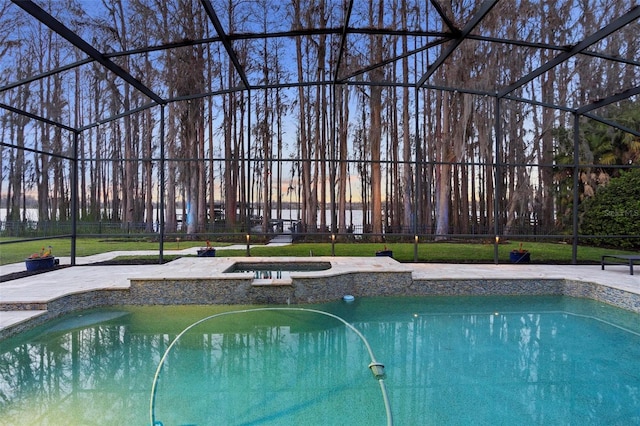 5524 Sail Ct, Orlando, FL 32819 - view of pool featuring glass enclosure, a patio, and a pool with connected hot tub