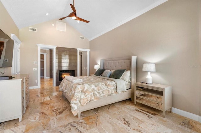 5524 Sail Ct, Orlando, FL 32819 - bedroom with high vaulted ceiling, light marble finish floors, a tiled fireplace, baseboards, and ceiling fan
