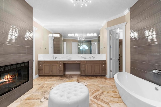 5524 Sail Ct, Orlando, FL 32819 - bathroom with a chandelier, double vanity, a freestanding bath, ornamental molding, and a stall shower