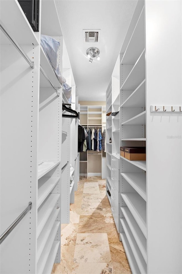 5524 Sail Ct, Orlando, FL 32819 - spacious closet featuring stone finish flooring