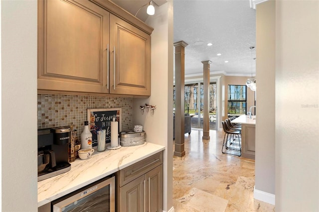 5524 Sail Ct, Orlando, FL 32819 - indoor dry bar featuring tasteful backsplash, wine cooler, decorative columns, crown molding, and baseboards