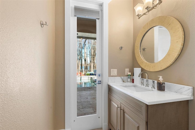 5524 Sail Ct, Orlando, FL 32819 - bathroom with vanity and a textured wall