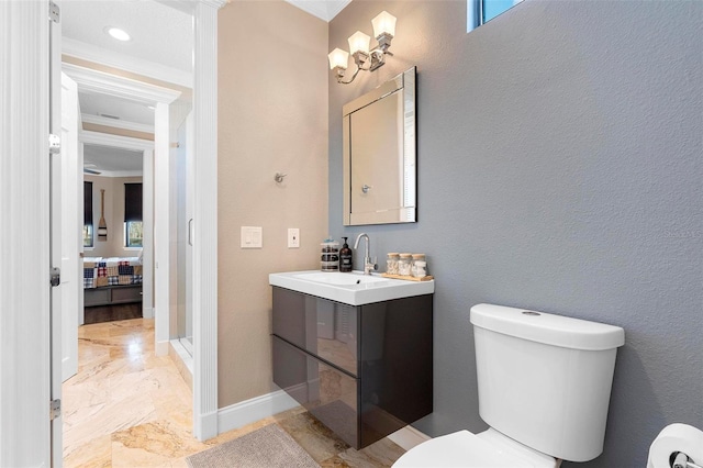 5524 Sail Ct, Orlando, FL 32819 - bathroom with toilet, vanity, ornamental molding, and marble finish floors