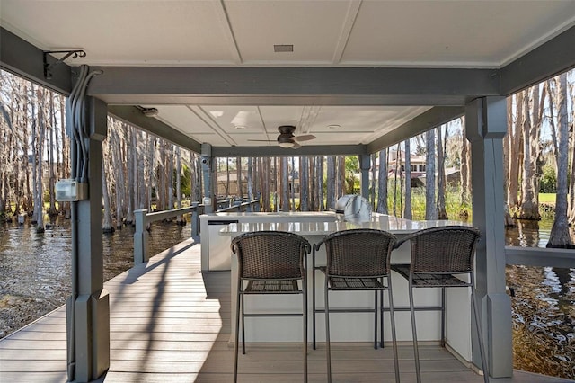 5524 Sail Ct, Orlando, FL 32819 - sunroom / solarium featuring a ceiling fan, a water view, and hardwood / wood-style floors