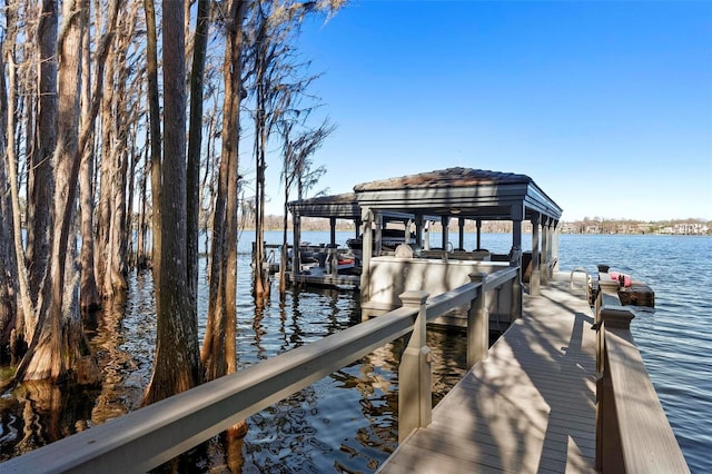 5524 Sail Ct, Orlando, FL 32819 - dock featuring boat lift and a water view