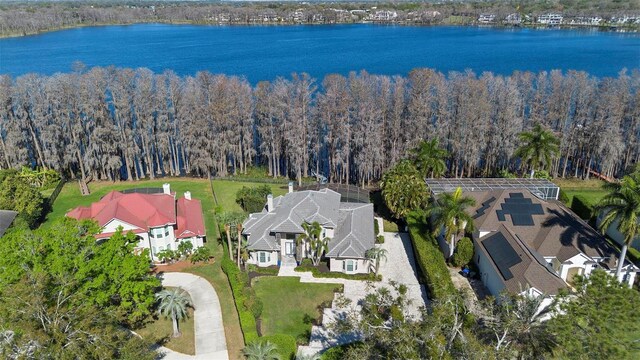 5524 Sail Ct, Orlando, FL 32819 - aerial view of property and surrounding area featuring a nearby body of water and a forest