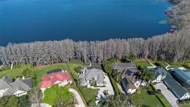 5524 Sail Ct, Orlando, FL 32819 - aerial view of property and surrounding area featuring nearby suburban area, a large body of water, and a heavily wooded area