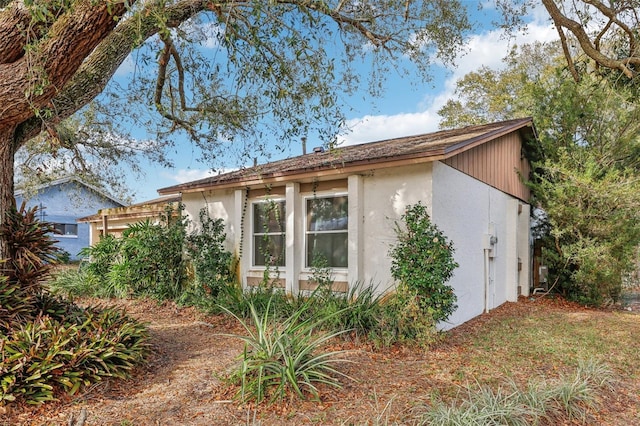 view of home's exterior with stucco siding