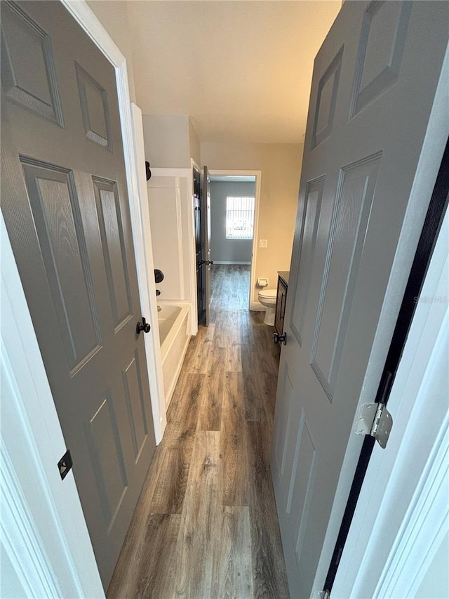 hallway featuring wood finished floors