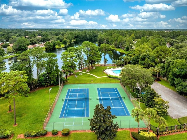 birds eye view of property with a water view