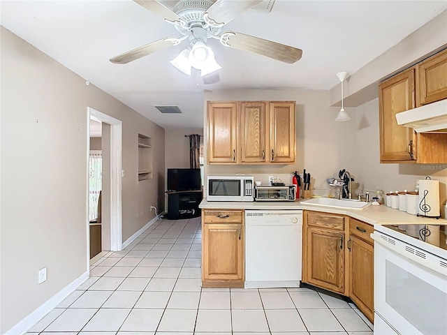 kitchen featuring light countertops, visible vents, light tile patterned flooring, a sink, and white appliances