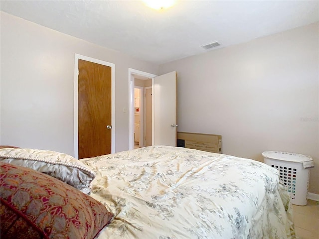 bedroom featuring visible vents