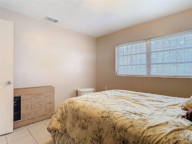 bedroom with visible vents and light tile patterned flooring