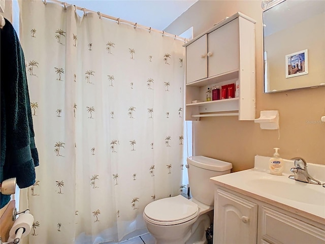 bathroom featuring toilet, a shower with curtain, and vanity