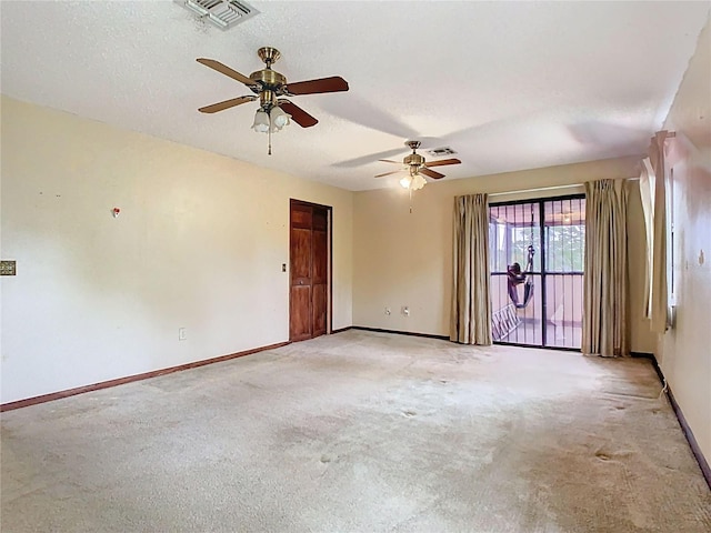 unfurnished room with light colored carpet, visible vents, and baseboards