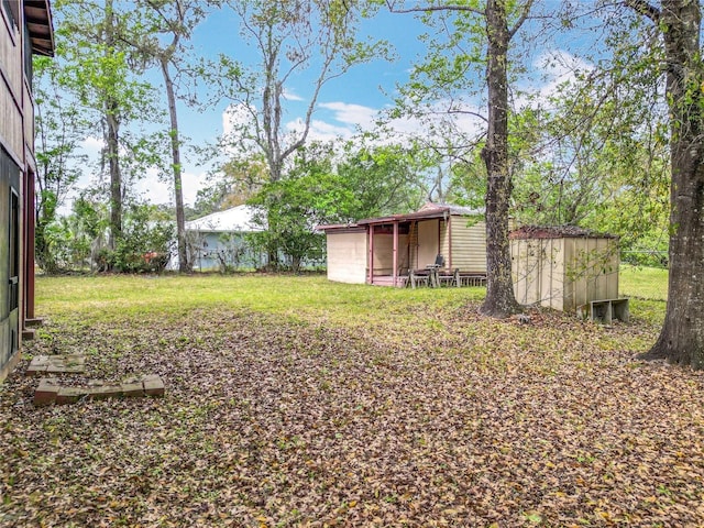 view of yard with a shed and an outdoor structure