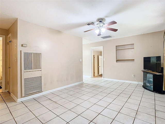 unfurnished living room with light tile patterned floors, baseboards, visible vents, and a ceiling fan