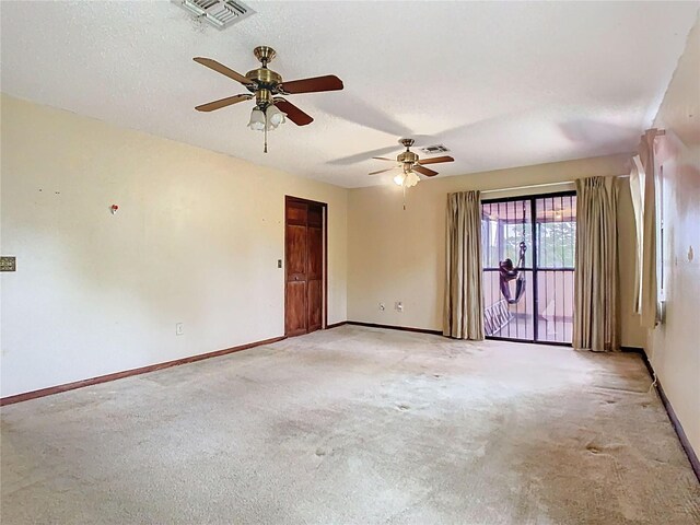 15523 Old Cheney Hwy, Orlando, FL 32828 - unfurnished room with baseboards, light carpet, ceiling fan, and a textured ceiling