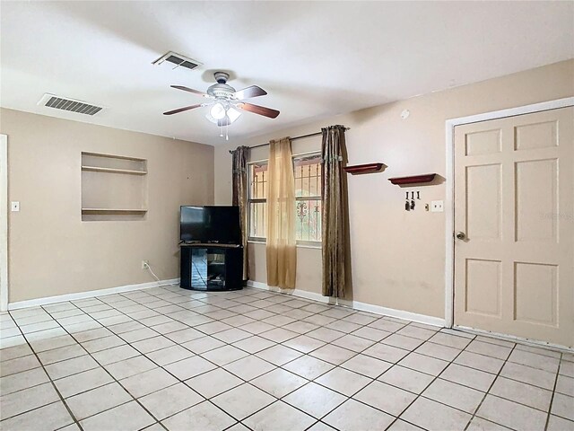 15523 Old Cheney Hwy, Orlando, FL 32828 - unfurnished living room with a ceiling fan, light tile patterned floors, and baseboards
