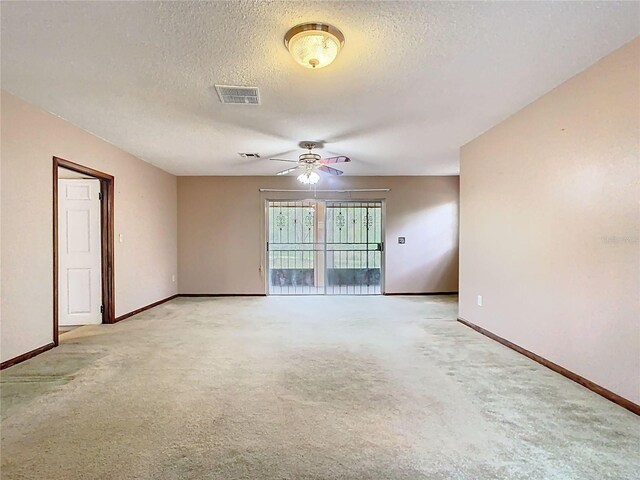 15523 Old Cheney Hwy, Orlando, FL 32828 - unfurnished room featuring a ceiling fan, a textured ceiling, baseboards, and light colored carpet