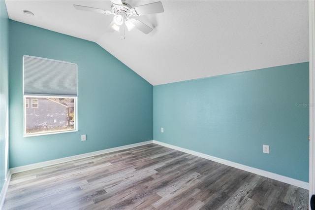 bonus room with lofted ceiling, ceiling fan, baseboards, and wood finished floors