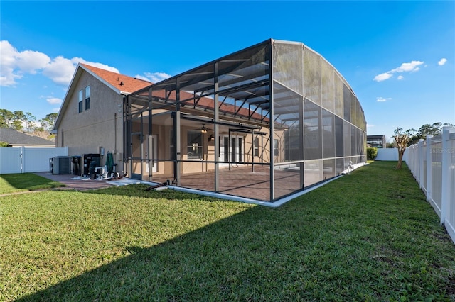 back of house with a patio area, a fenced backyard, and a lawn