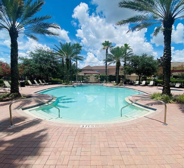 pool with a patio area