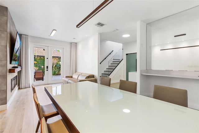 dining room featuring french doors, recessed lighting, visible vents, stairway, and light wood-type flooring