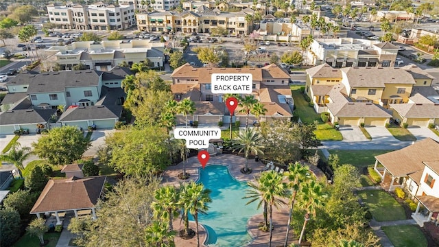 birds eye view of property with a residential view