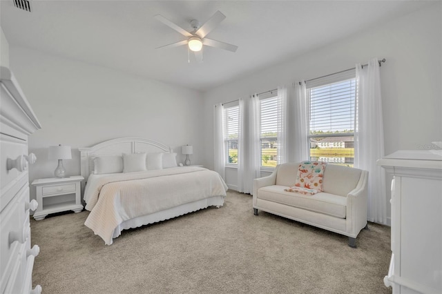 bedroom with a ceiling fan, carpet, and visible vents