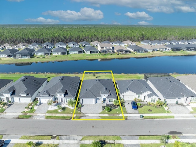 birds eye view of property featuring a residential view and a water view