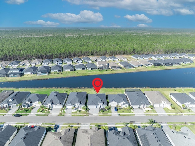 bird's eye view with a water view and a residential view