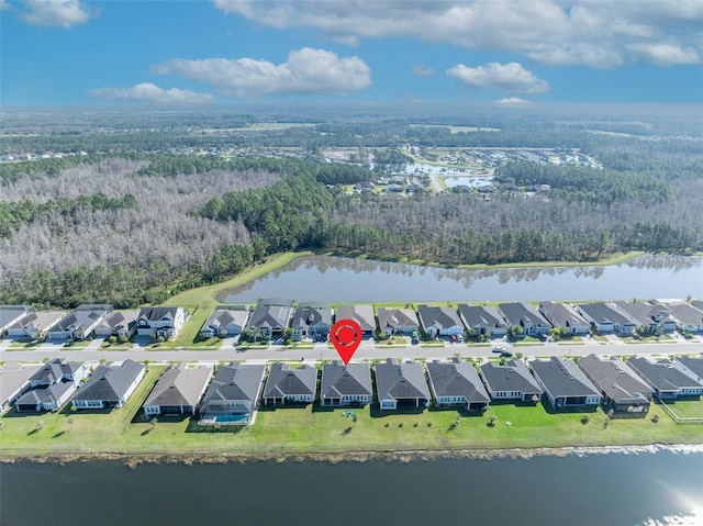 drone / aerial view with a water view and a residential view