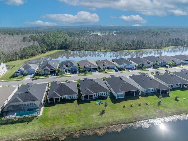 bird's eye view with a water view, a forest view, and a residential view