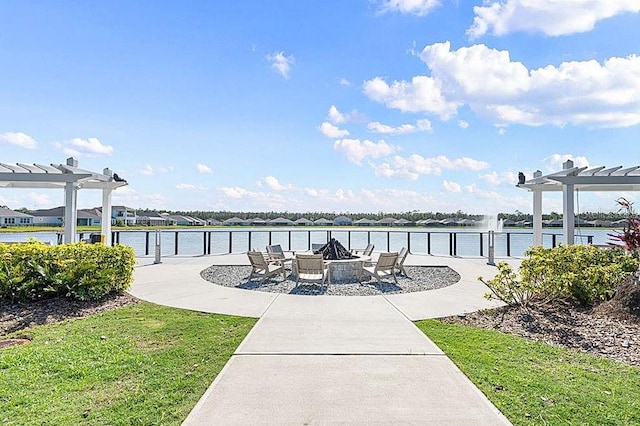 surrounding community featuring a patio, an outdoor fire pit, a water view, and a pergola