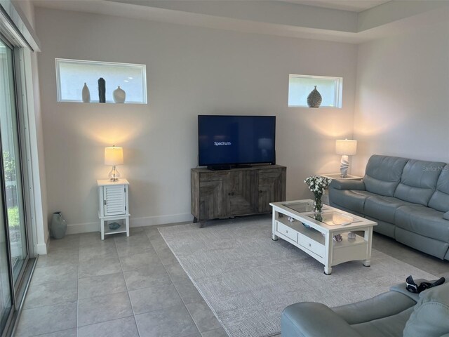 585 Mosaic Blvd, Daytona Beach, FL 32124 - living room with baseboards and a healthy amount of sunlight