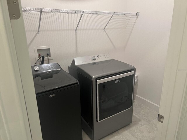 585 Mosaic Blvd, Daytona Beach, FL 32124 - washroom featuring laundry area and washing machine and dryer